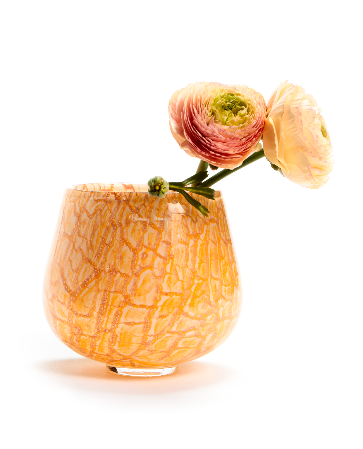 Handmade glass vase in a opaque tangerine color with marbling details and two orange flowers