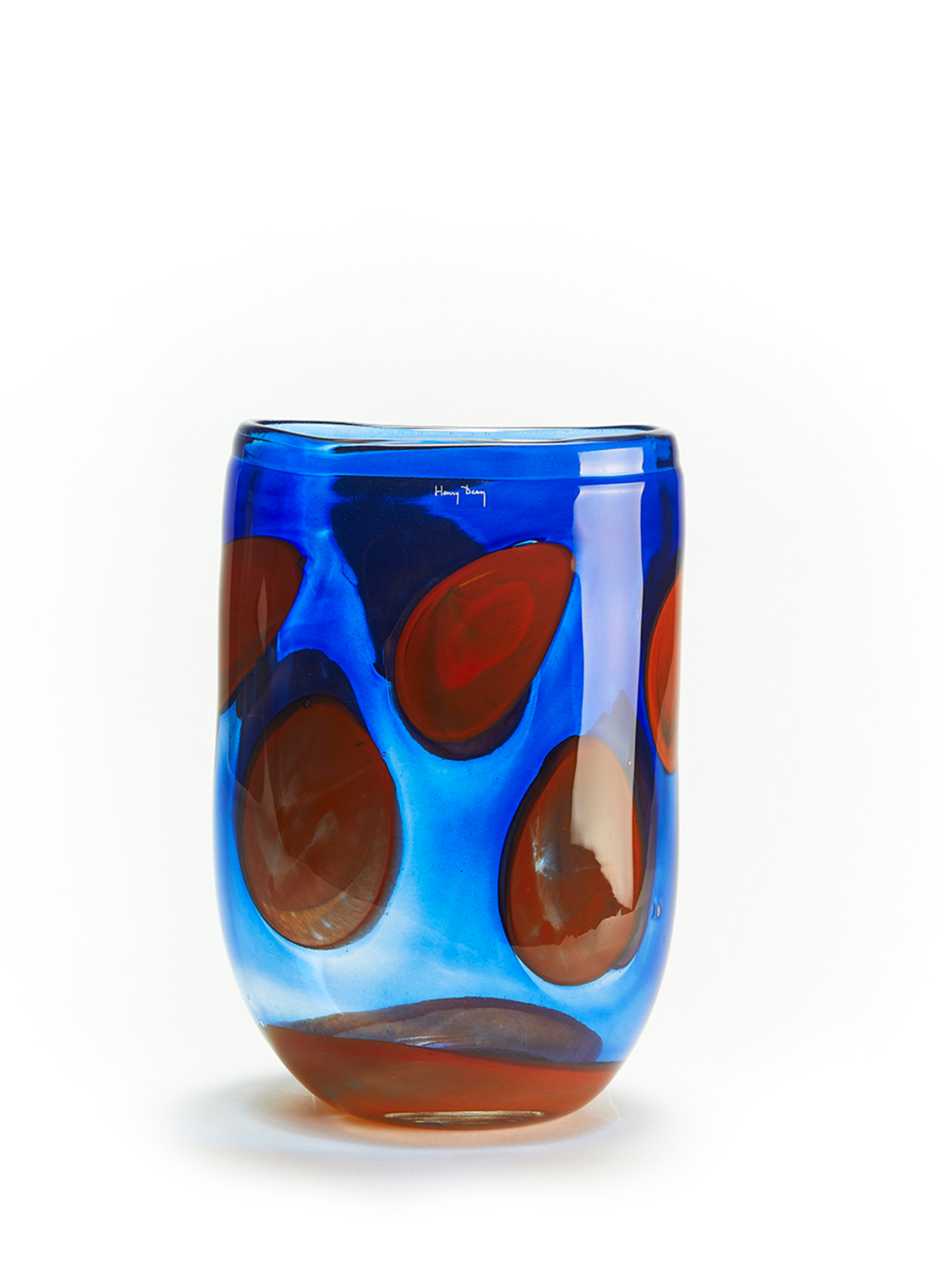 Tall handmade dark blue glass vase with orange spots