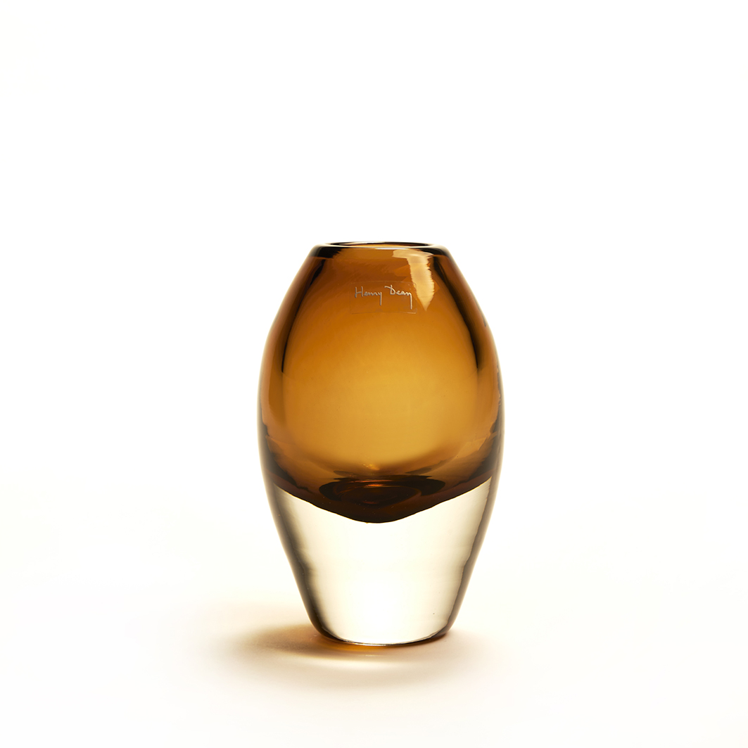 Oval shaped handmade glass vase in a cognac color